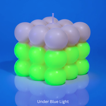 Bubble Candle under UV Light with florescent green & with text 'Under Blue Light'.
Sensations Unleashed BDSM Glow in the Dark + UV Wax Play Big Bubble Candle In India (Double Colour)