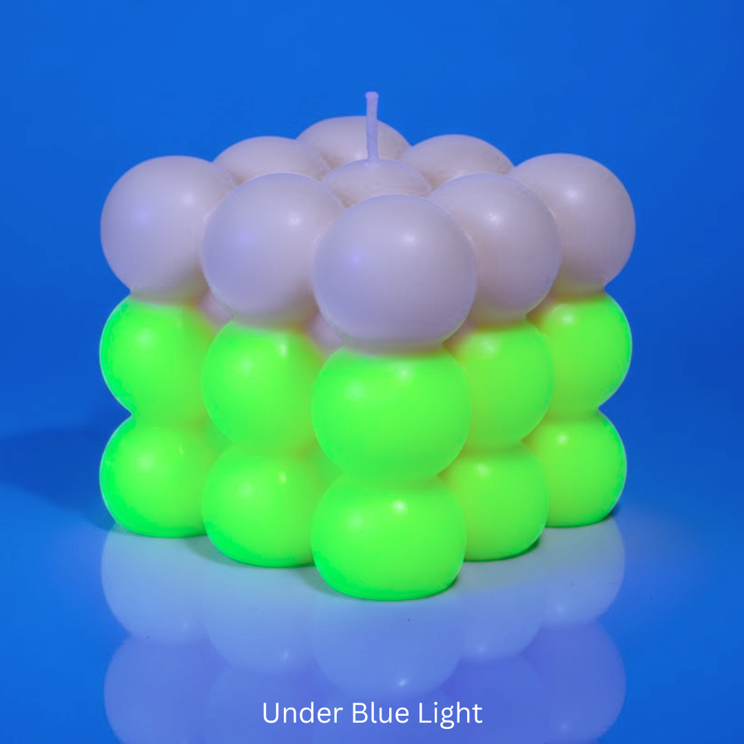 Bubble Candle under UV Light with florescent green & with text 'Under Blue Light'.

Sensations Unleashed BDSM Glow in the Dark + UV Wax Play Big Bubble Candle In India (Double Colour)