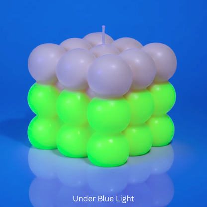 Bubble Candle under UV Light with florescent green & with text 'Under Blue Light'.

Sensations Unleashed BDSM Glow in the Dark + UV Wax Play Big Bubble Candle In India (Double Colour)