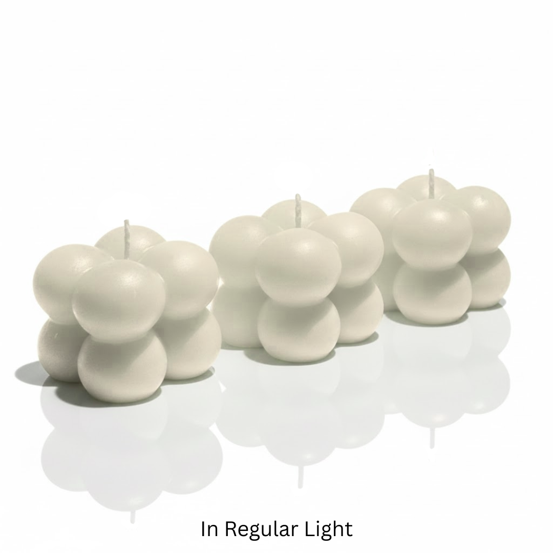Set of white bubble candles on a white surface with 'In Regular Light' text.

Sensations Unleashed BDSM Glow in the Dark Wax Play Bubble Candles In India - Set of 3