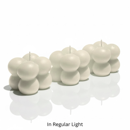 Set of white bubble candles on a white surface with 'In Regular Light' text.

Sensations Unleashed BDSM Glow in the Dark Wax Play Bubble Candles In India - Set of 3