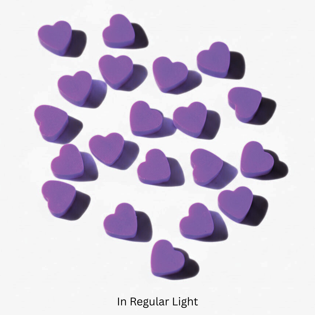Purple heart-shaped wax melts on a white background

Sensations Unleashed BDSM Non UV Wax Play Candle Melts In India - Set of 20 Pellets
