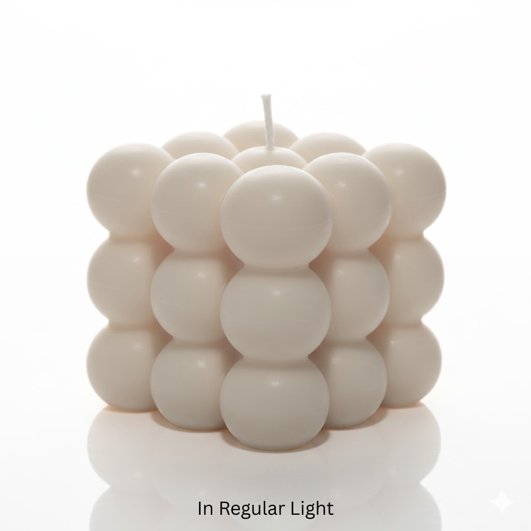 Cylindrical candle with stacked sphere design on a white background

Glowing green candle with a cube-like bubble design on a black background

Sensations Unleashed BDSM Glow in the Dark Wax Play Big Bubble Candle In India