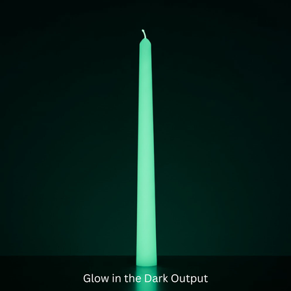 Glowing green candle against a black background with text 'Glow in the Dark Output'. Sensations Unleashed BDSM Glow in the Dark Wax Play Tapered Candle In India