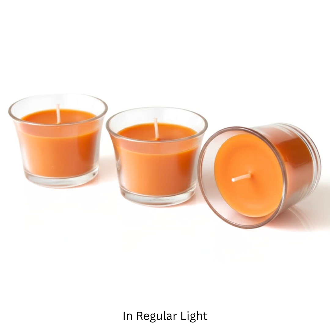 Three glass candles with orange wax on a white background Sensations Unleashed BDSM UV Wax Play Tea Light Candle In India - Set of 3